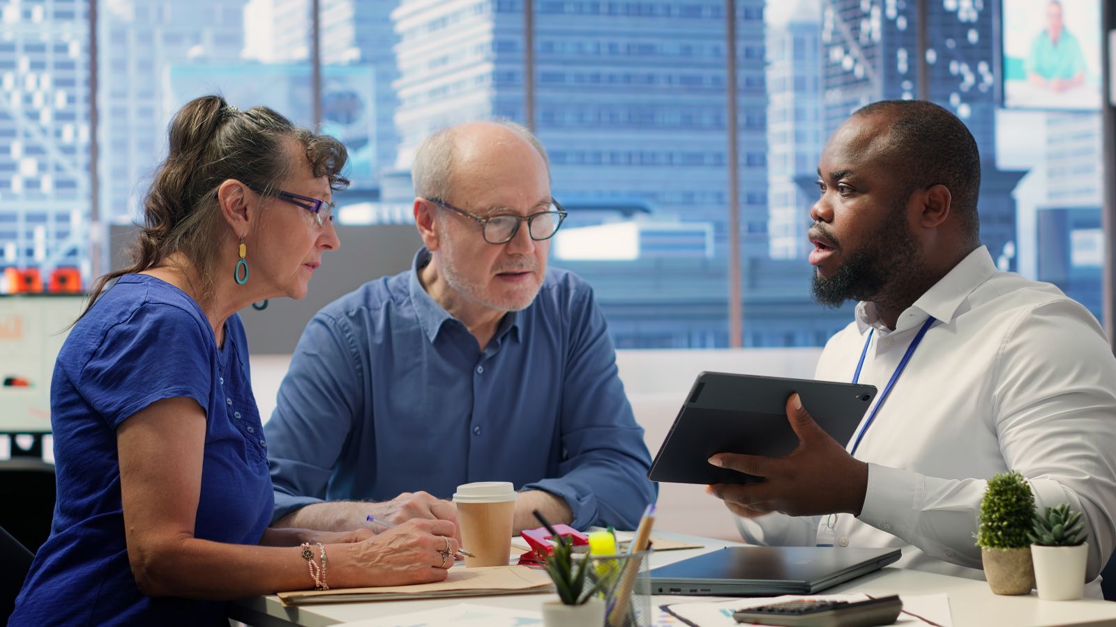 A Sydney business team working together around a laptop